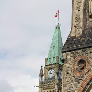 Picture of Canadian flag flying over parliament building