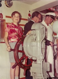 Photo of John at age 11 at the helm of the MS Gripsholm