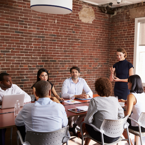 group of people seated around a table