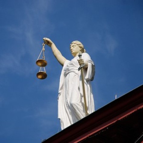 Pic of statue holding scales of justice