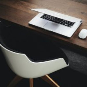 Picture of desk and chair with laptop