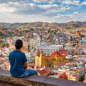 Picture of man standing and looking at view of city