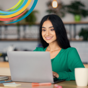 Picture of smiling woman looking at laptop