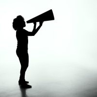 Image of person speaking into a bullhorn/megaphone