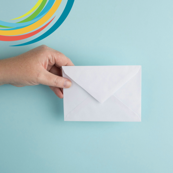 Picture of hand holding unopened envelope