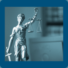 Lady Justice Statue with blue background