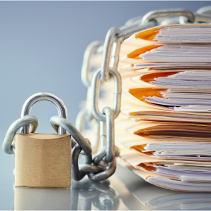 Picture of pile of file folders with chain and lock around it