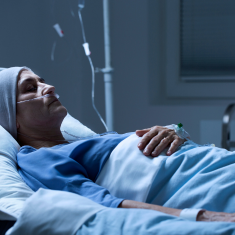 Picture of sick woman lying in hospital bed