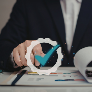 Picture of person stamping document with approved checkmark sign