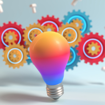 Picture of brightly coloured lightbulb with brightly coloured wheel cogs in the background