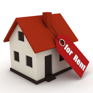 Picture of toy model house with a For Rent sign hanging from chimney