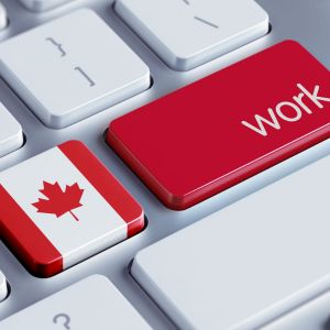 Picture of the keyboard with a red key that says work and another key that has a canadian flag