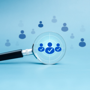 Picture of people icons on blue background 3 icons in magnifying glass with check mark 