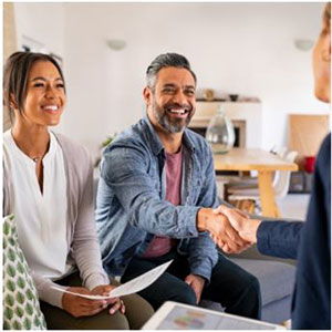 Picture of couple shaking hands with pension rep
