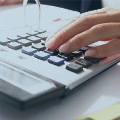 Picture of hand working on a calculator