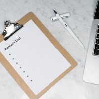 Brown clipboard with a white sheet of paper entitle 