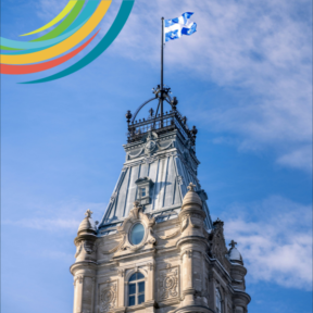 A partial image of the National Assembly of Quebec. The Provincial flag of Quebec is flying at full mast. 