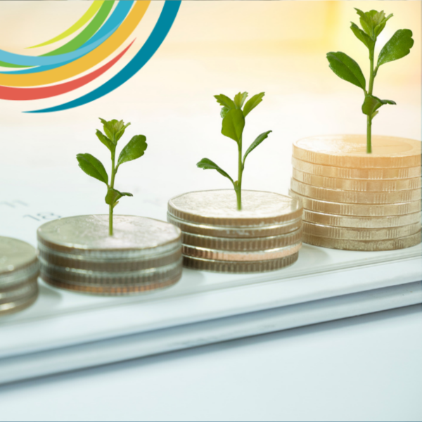 Picture of 3 small plants growing out of stacks of coins. Each stack of coin is a different height