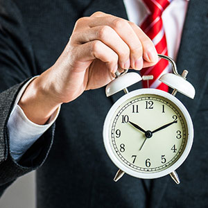 Picture of man holding clock