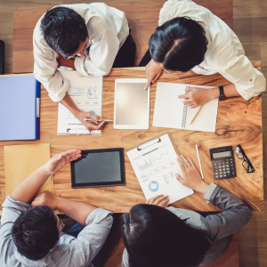 Picture of office workers around a table