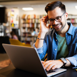 Picture of man looking at a laptop