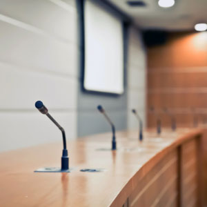 Picture of conference desk with microphones