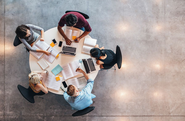 staff members working around a table