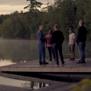 CCCC staff next to a lake