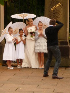 Bridal party coping with rain