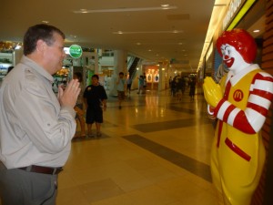 John and Ronald John and Ronald McDonald exchanging a wei