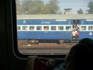 People hanging on to a train