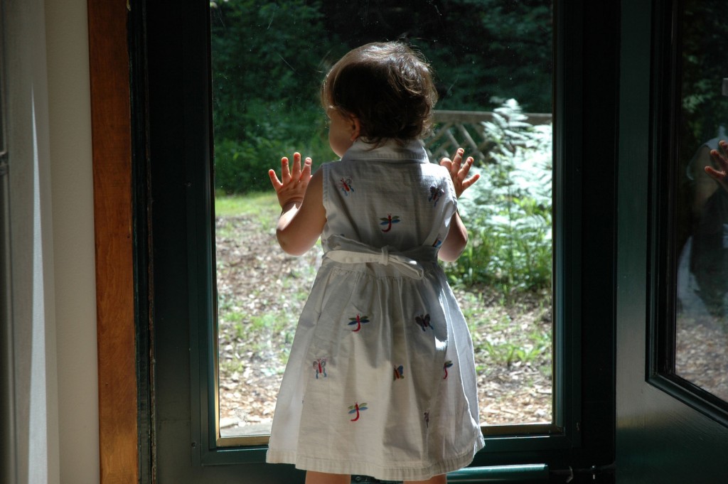 Girl looking out window