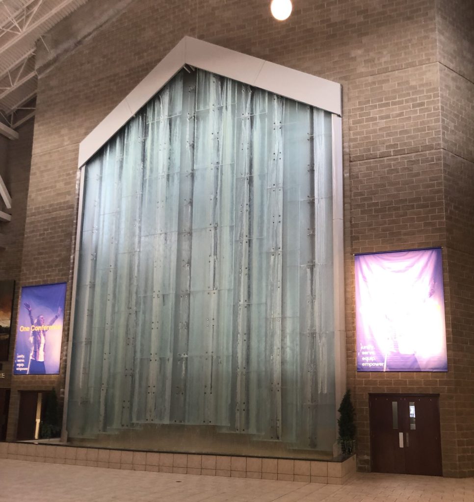 Photo of a 50' high waterfall in a church foyer.
